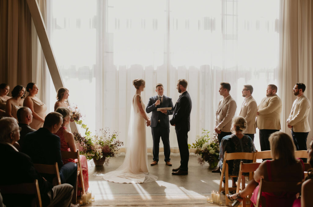 Wedding ceremony with grounded floral installation